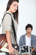 female singer with electric guitar