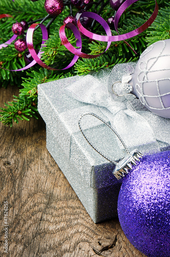 Photo: Christmas gift box and festive decorations Christmas gift box and festive decorations