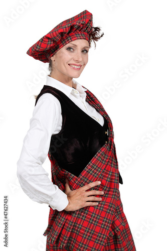 Photo: Woman in a traditional tartan outfit Woman in a traditional tartan outfit