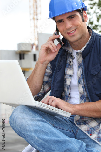 Photo: Foreman with mobile and laptop Foreman with mobile and laptop