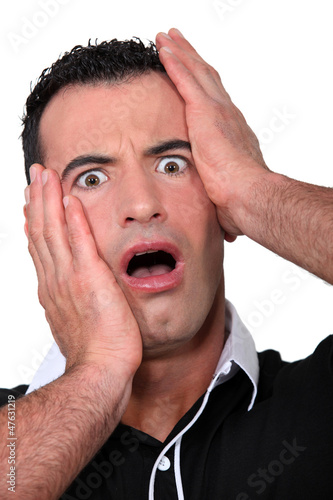 Photo: Man open mouthed in horror Man open mouthed in horror