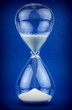 Hourglass on blue background