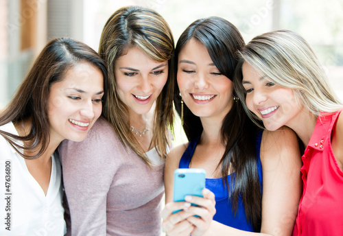 Photo: Girls with a cell phone Girls with a cell phone