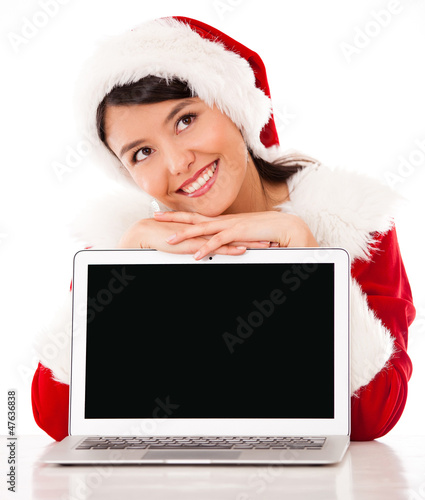 Photo: Thoughtful female Santa with laptop Thoughtful female Santa with laptop