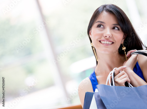 Photo: Thoughtful shopping woman Thoughtful shopping woman