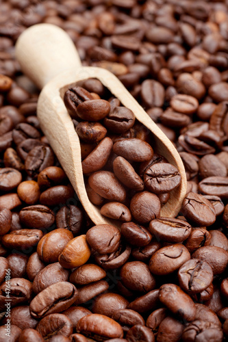 Photo: coffee beans and wooden scoop coffee beans and wooden scoop
