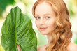 woman with green leaf