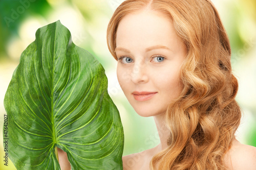 Photo: woman with green leaf woman with green leaf