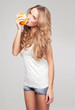 Portrait of young woman with orange 