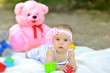 Sweet baby girl playng outdoors