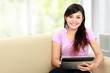 Photo: happy asian woman using tablet pc happy asian woman using tablet pc