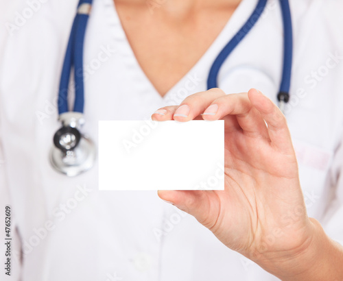 Photo: Female doctor shows empty white card Female doctor shows empty white card