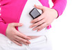 Hands of pregnant woman holding phone with unreal design