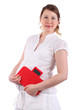 Pregnant woman in white holds red balance isolated on white