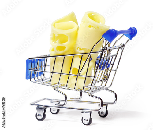 Photo: Two appetizing pieces of yellow cheese in shopping cart isolated Two appetizing pieces of yellow cheese in shopping cart isolated