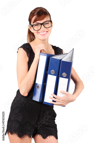 Photo: Smiling girl in big glasses holds three large blue folders Smiling girl in big glasses holds three large blue folders