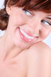 Close-up portrait of beautiful smiling young caucasian woman