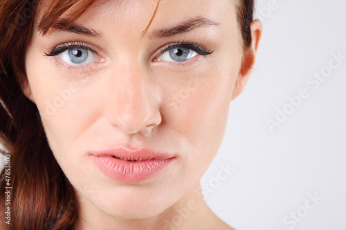 Photo: Close-up of beautiful melancholy pretty caucasian woman Close-up of beautiful melancholy pretty caucasian woman
