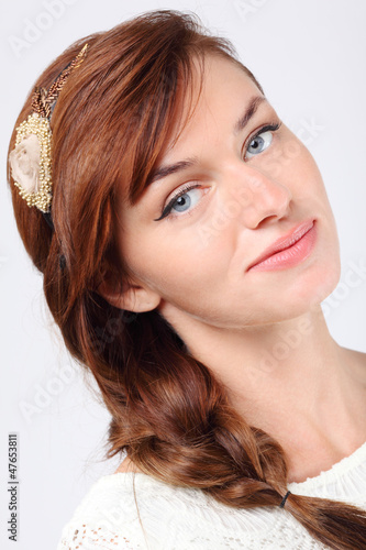 Photo: Close-up portrait of beautiful smiling young caucasian woman Close-up portrait of beautiful smiling young caucasian woman