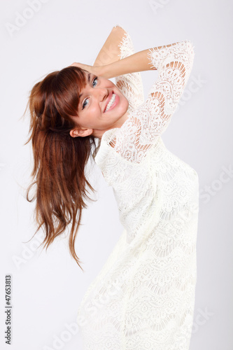 Photo: Portrait of beautiful young caucasian woman in white Portrait of beautiful young caucasian woman in white