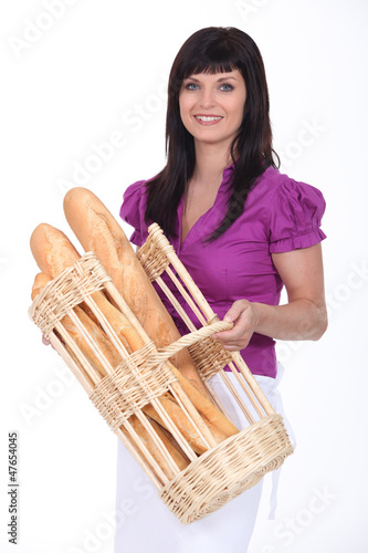Photo: Woman with basket of bread Woman with basket of bread