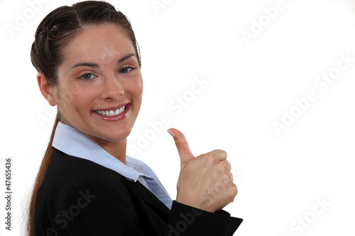 Photo: A businesswoman giving the thumb up. A businesswoman giving the thumb up.