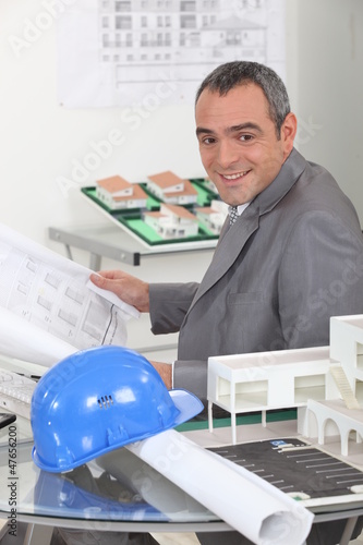 Photo: An architect working in his office An architect working in his office