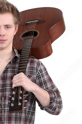 Photo: young man with an acoustic guitar young man with an acoustic guitar