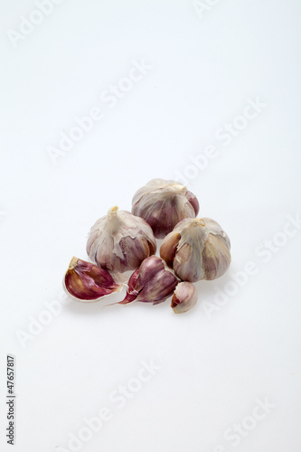 Photo: fresh garlic on white background fresh garlic on white background