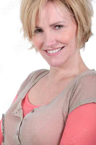 Photo: Closeup of a smiling woman with short blonde hair Closeup of a smiling woman with short blonde hair