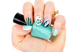 Female hands with luxory jevelery and blue modern manicure