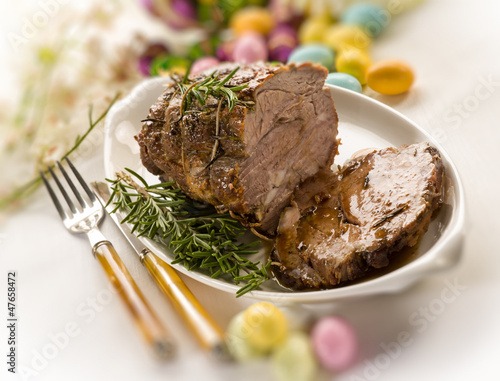 Photo: roasted meat over easter table, selective focus roasted meat over easter table, selective focus