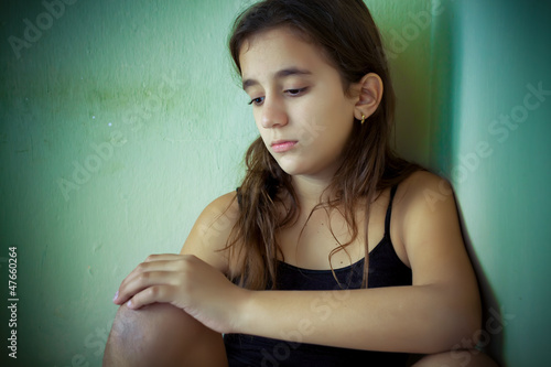 Photo: Hispanic girl with a very sad expression Hispanic girl with a very sad expression