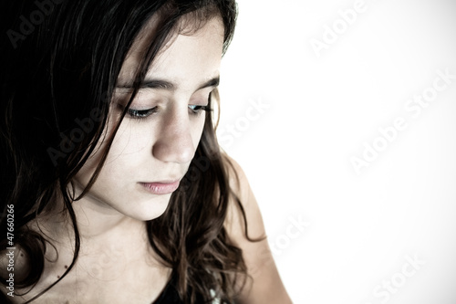 Photo: Desaturated portrait of a sad hispanic girl Desaturated portrait of a sad hispanic girl