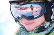 Photo: Closeup portrait of a female skier standing on a skiing slope Closeup portrait of a female skier standing on a skiing slope