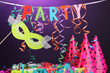 Party items on purple background