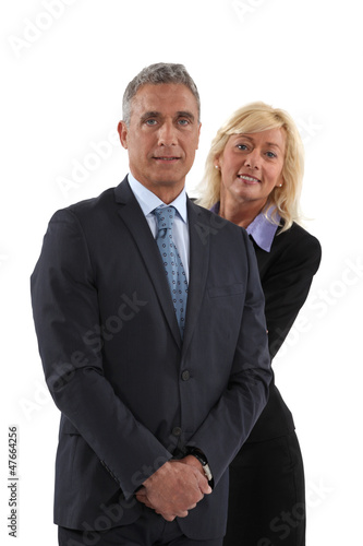 Photo: Blonde woman behind man in a suit Blonde woman behind man in a suit