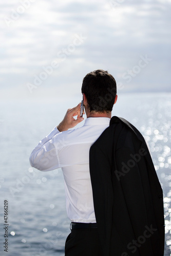 Photo: businessman talking on the phone businessman talking on the phone