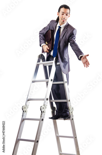 Photo: Businessman climbing career ladder on white Businessman climbing career ladder on white
