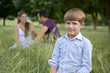 Photo: Happy family with son and parents in park Happy family with son and parents in park