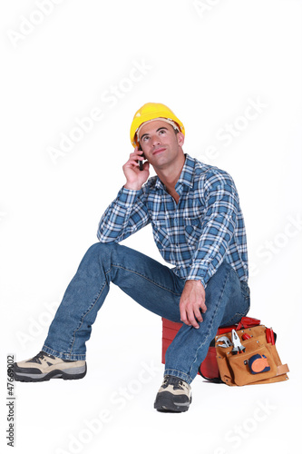 Photo: Worker taking a call Worker taking a call