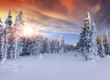 Beautiful winter sunrise in the mountains. Dramatic red  sky
