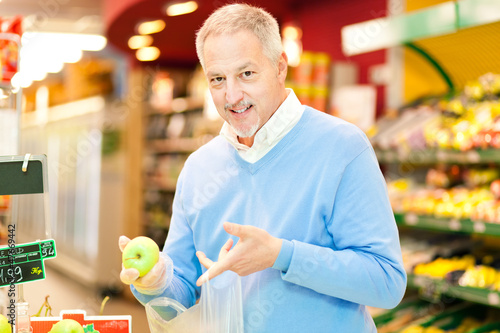 Photo: Man shopping at the supermarket Man shopping at the supermarket