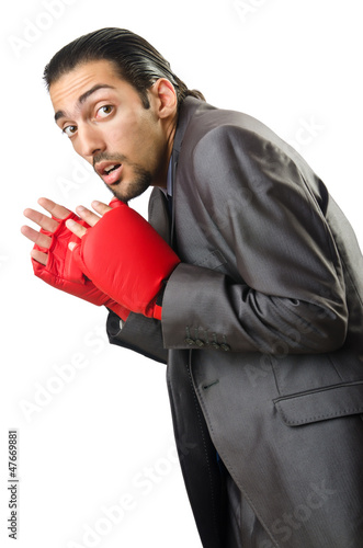 Photo: Businessman with boxing gloves on white Businessman with boxing gloves on white