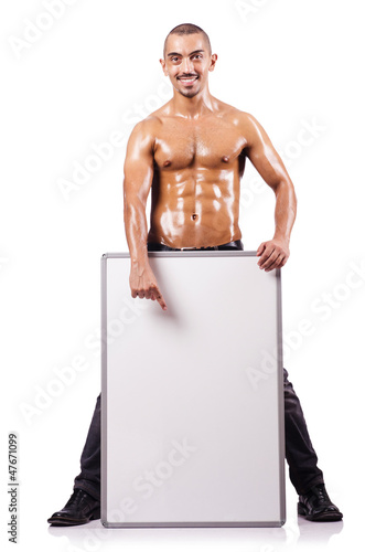 Photo: Naked man with blank board Naked man with blank board