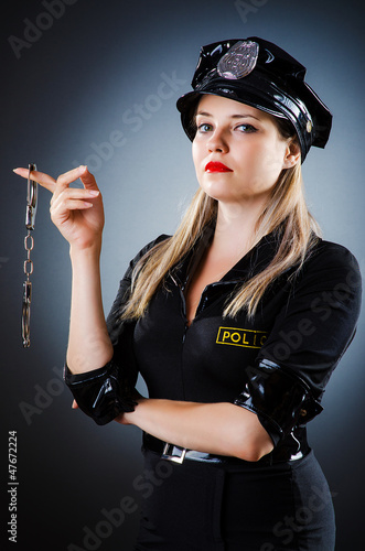 Photo: Attractive police office in dark room Attractive police office in dark room