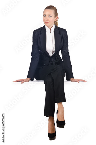 Photo: Woman businesswoman sitting on virtual wall Woman businesswoman sitting on virtual wall
