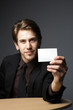 Young man with a business card