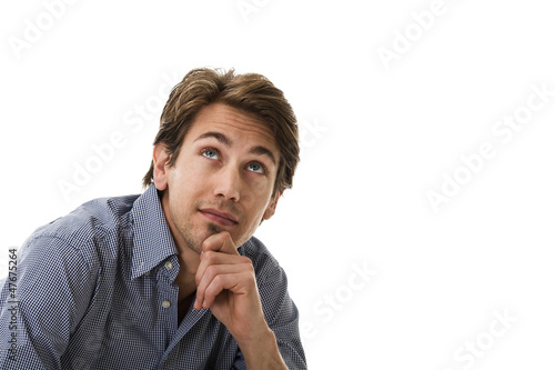 Photo: Handsome young man thinking Handsome young man thinking