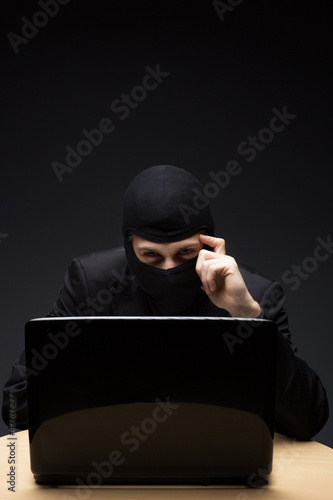 Photo: Furtive computer hacker Furtive computer hacker